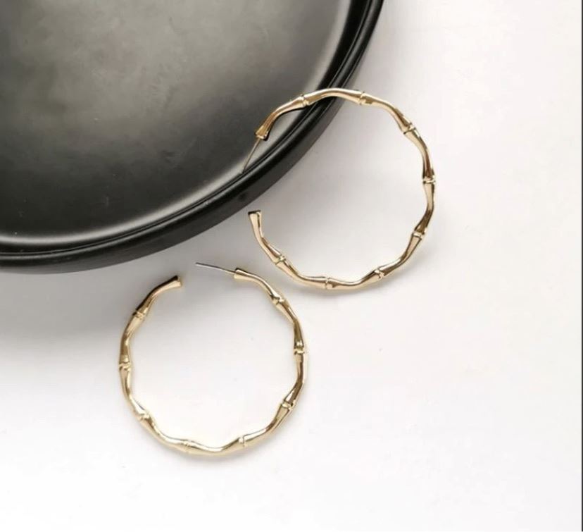 BAMBOO Hoop Earrings - Gold up close against black